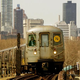 A New York City subway train travels aboveground with the Manhattan skyline in the background March 24, 2004.
Mario Tama/Getty Images